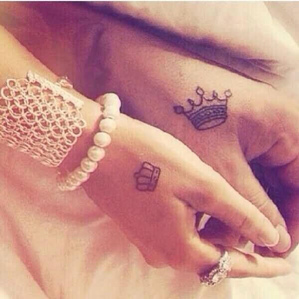 Classic Queen And King Tattoo On Couple Hand