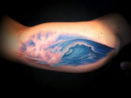 Colored Inner Bicep Realistic Wave Tattoo On Bicep