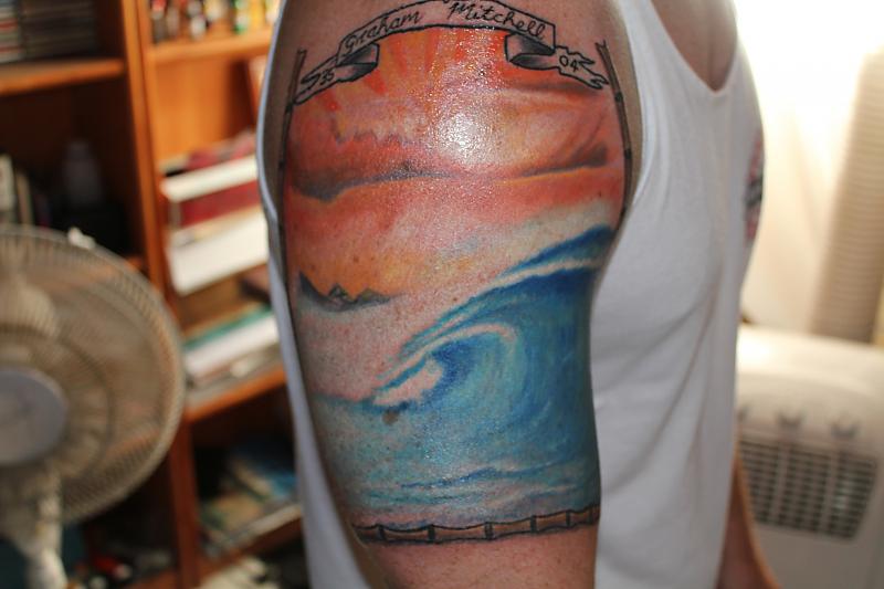 Colored Wave Tattoo On Man Right Half Sleeve