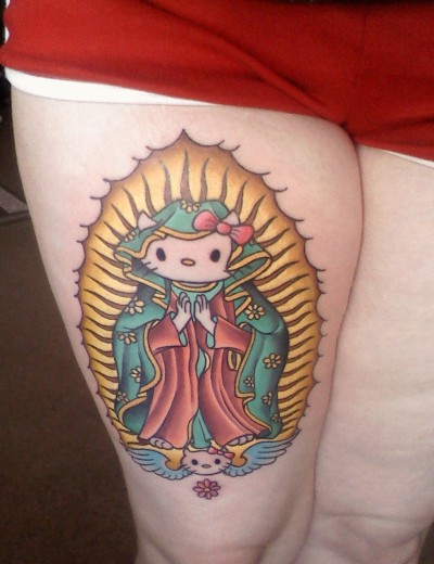 Colorful Hello Kitty Saint Mary Tattoo On Thigh