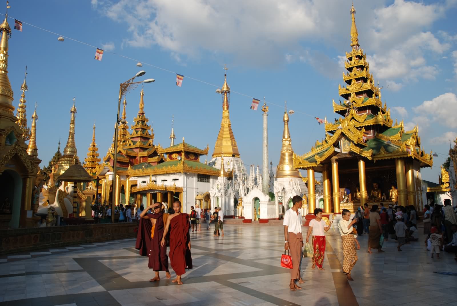 Devotees At The Shwedagon Pagoda