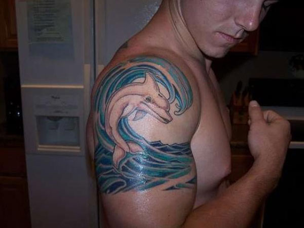 Dolphin And Realistic Wave Tattoo On Right Shoulder