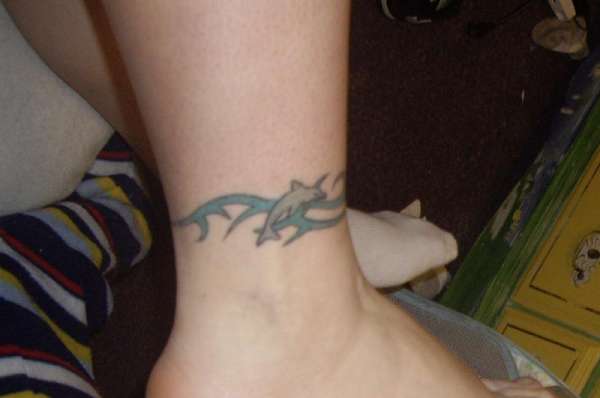 Dolphin And Tribal Wave Tattoo On Ankle