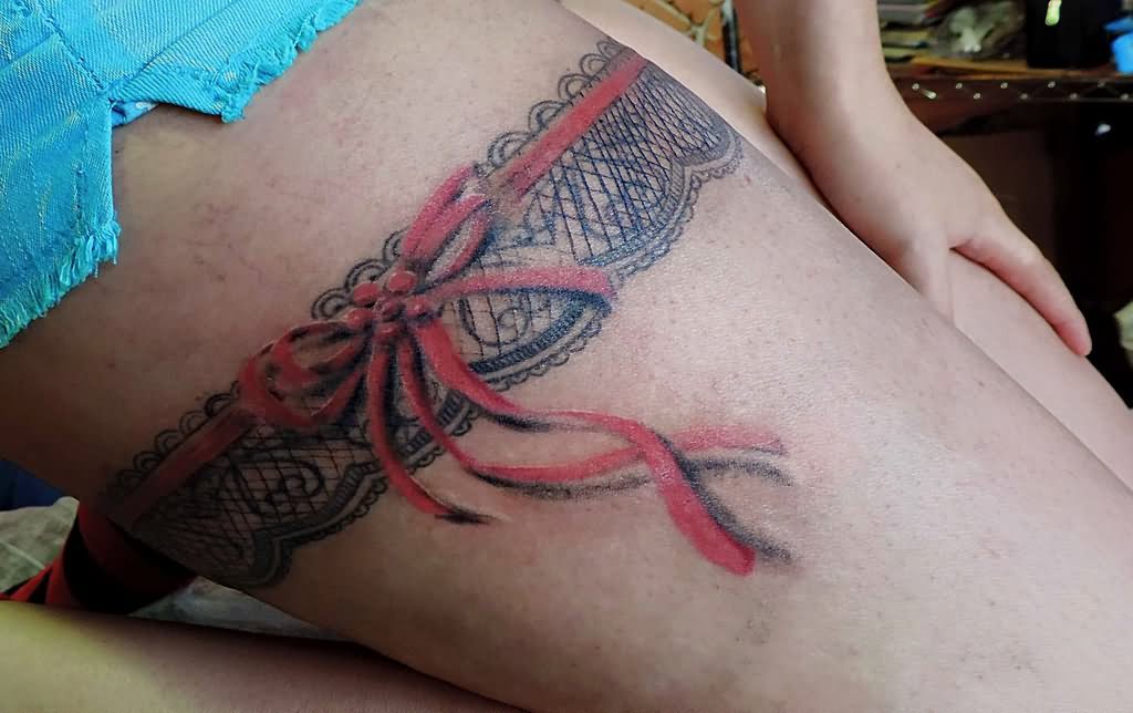 Garter Tattoo On Right Thigh by Facundo Pereyra