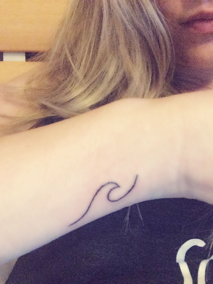 Girl Showing Simple Wave Tattoo On Wrist