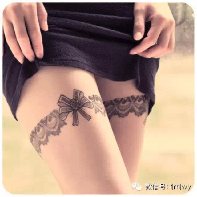 Grey Bow And Flower Garter Tattoos On Both Thigh