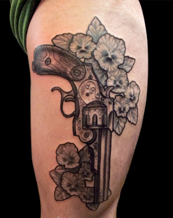 Grey Flowers And Gun Garter Tattoo