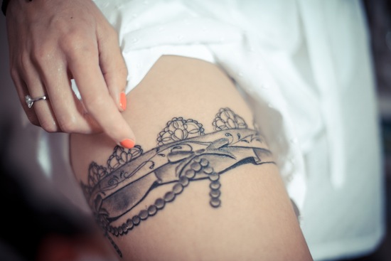 Grey Ink Flower Garter Tattoo On Thigh