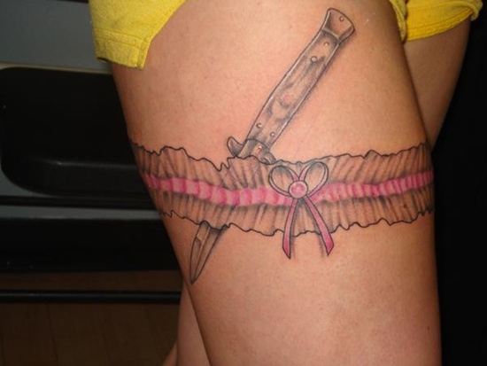 Grey Ink Knife And Garter Belt Tattoo