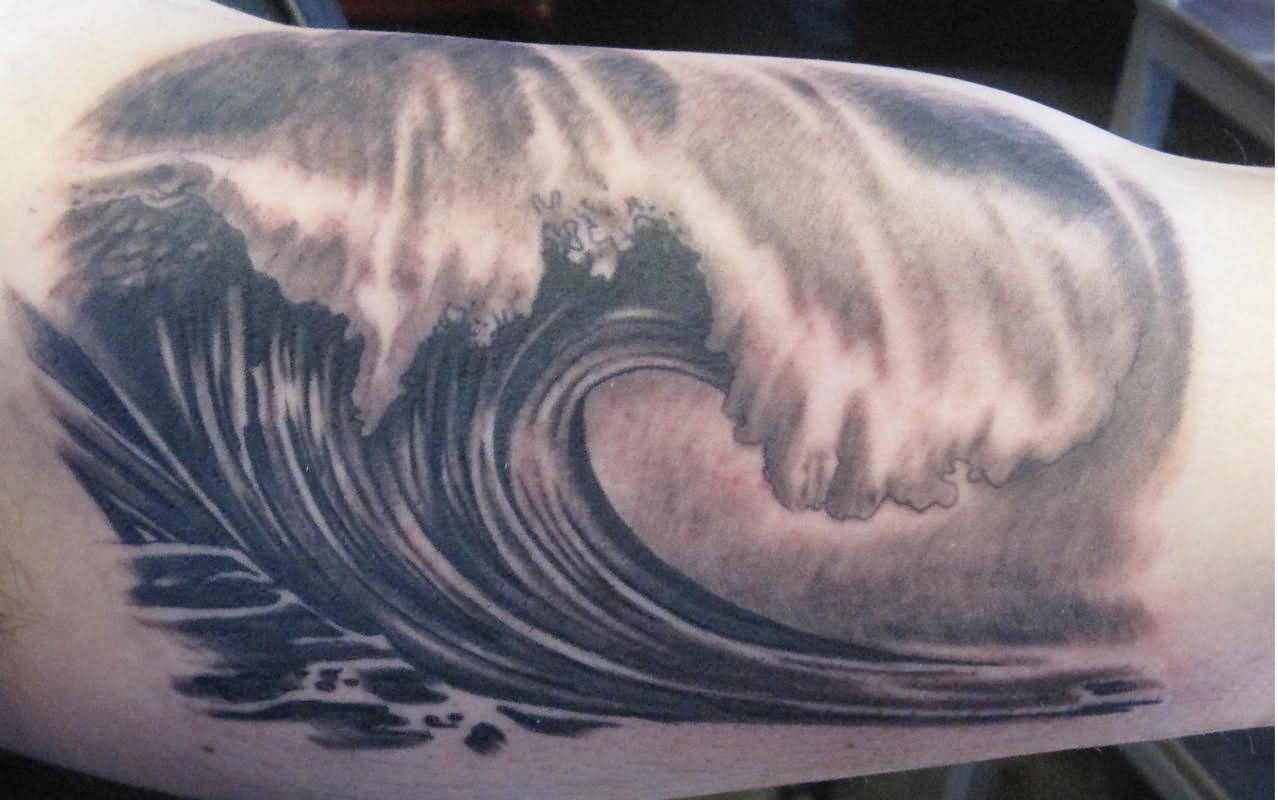 Grey Ink Wave Tattoo On Bicep