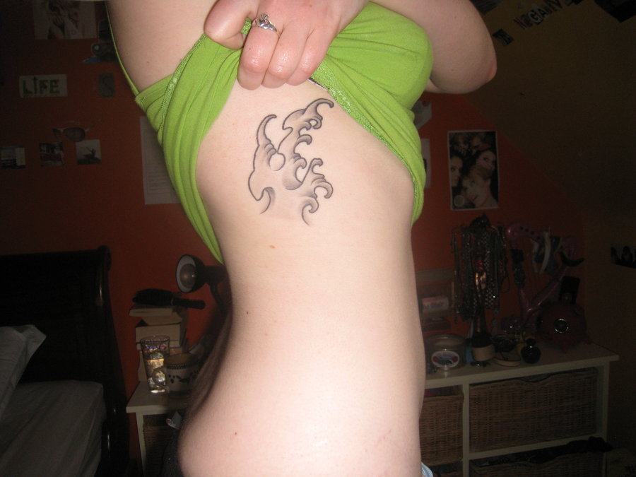 Grey Ink Wave Tattoo On Side Rib by Girlrocker