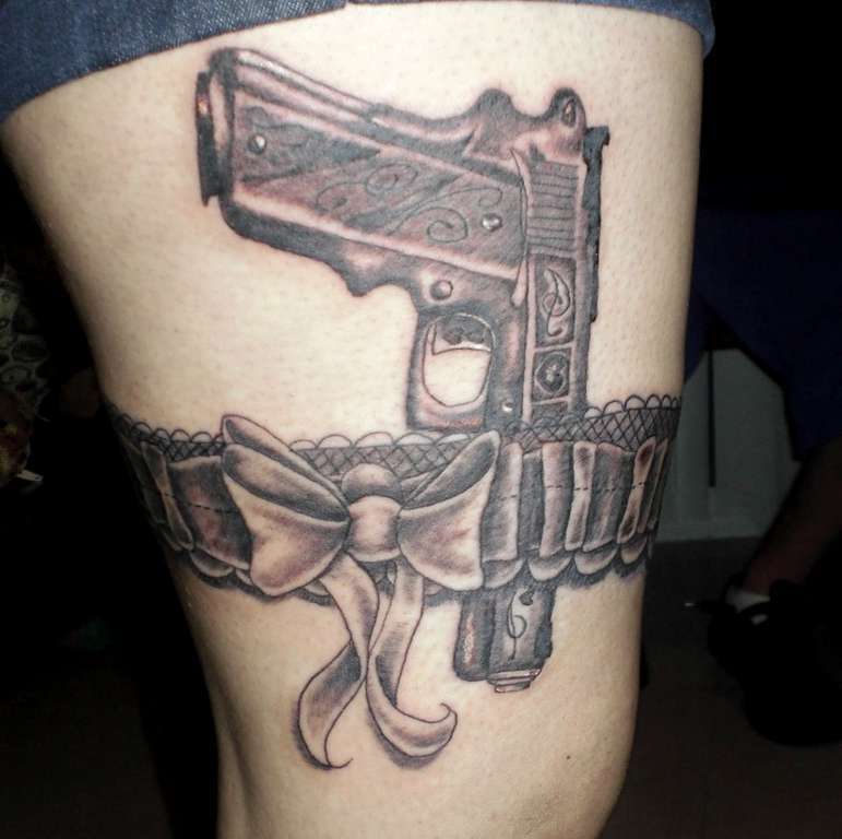Gun And Bow Grey Ink Garter Belt Tattoo