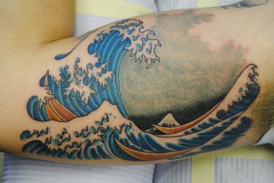 Japanese Realistic Colored Wave Tattoo On Bicep