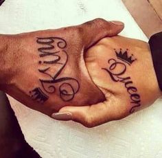 King And Queen Word With Crown Tattoo On Couple Hand