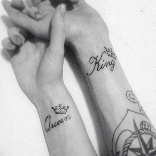 King And Queen Word With Crown Tattoo On Couple Wrist