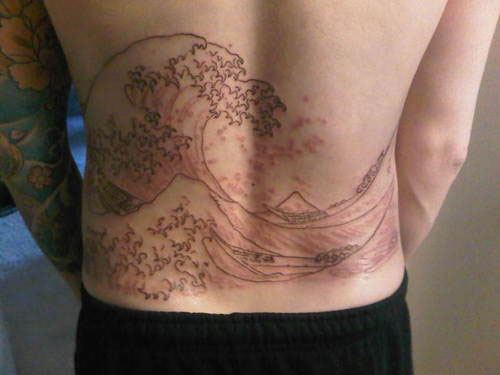 Outline Wave Tattoo On Lower Back