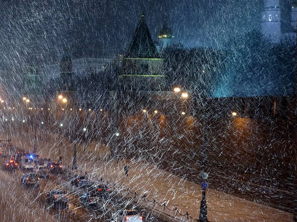Picture Of Snow Blowing At Night Outside The Kremlin