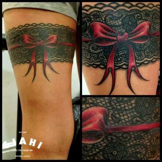 Red Bow Garter Tattoo On Thigh