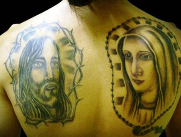 Saint Mary And Jesus Face Tattoo On Upper Back