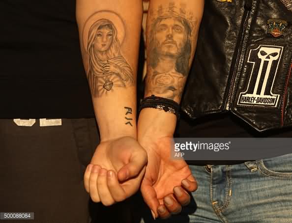 Saint Mary And Jesus Tattoo On Couple Forearm