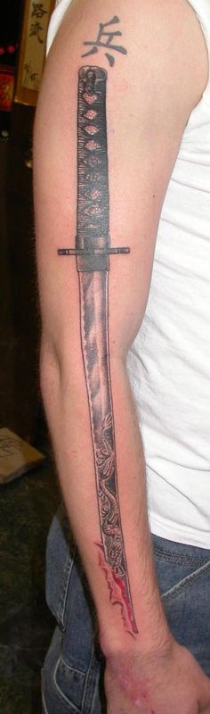Samurai Sword Tattoo On Right Sleeve