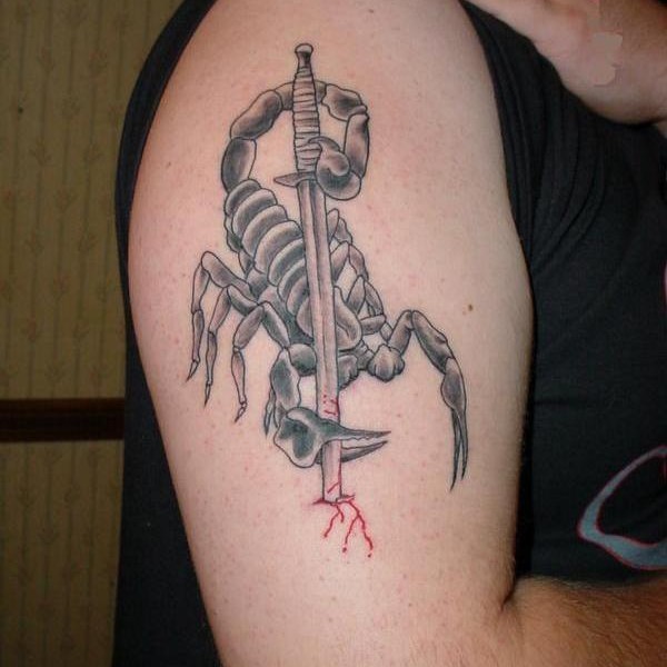 Scorpion With Sword Tattoo On Upper Arm