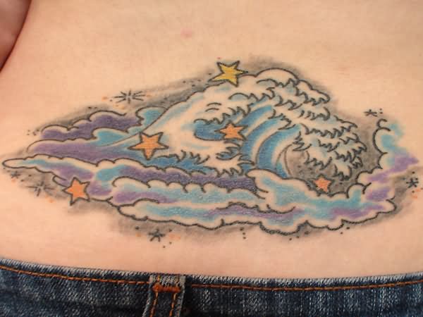 Stars And Wave Tattoo On Lower Back