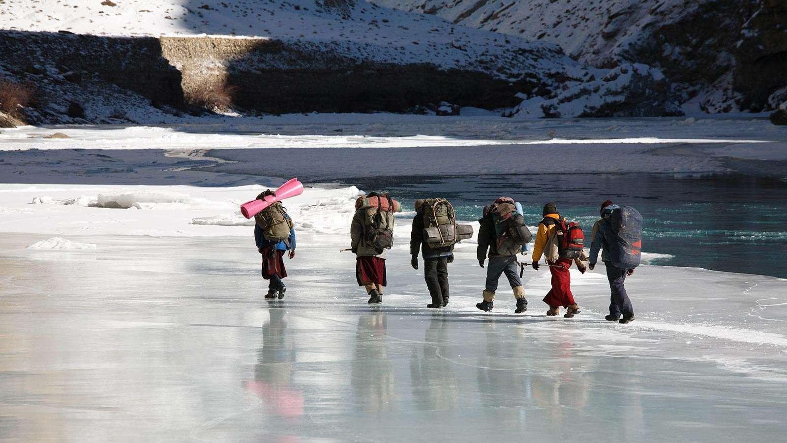 Trekers On Frozen River In Zanskar Valley