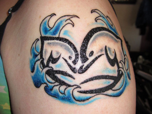 Tribal Dolphins And Waves Tattoo On Shoulder