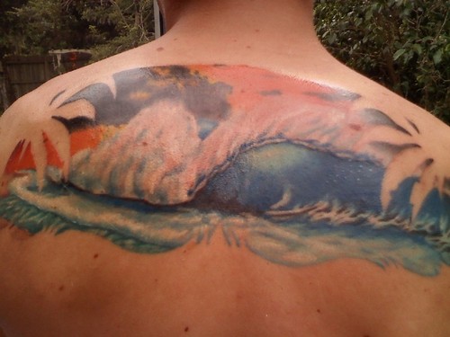 Upper Back Wave Tattoo On Upper Back