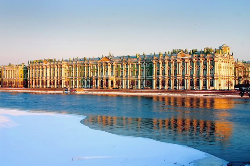 View Of Hermitage Museum During Sunset Across The Neva River
