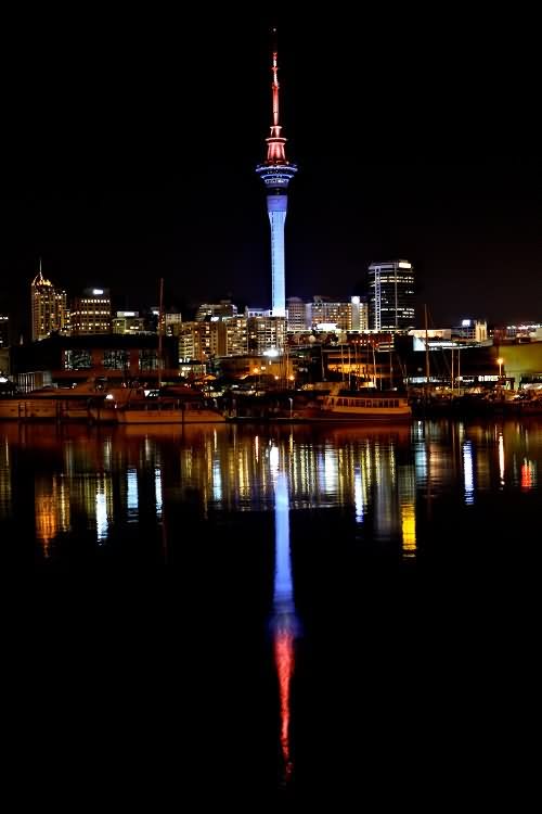Water Reflection Of The Sky Tower At Night