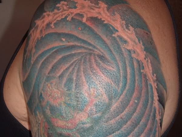 Water Wave Tattoo On Left Shoulder