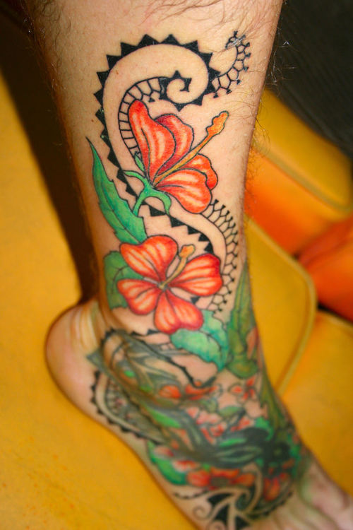 Amazing Colored Hibiscus Tattoo On Leg And Foot