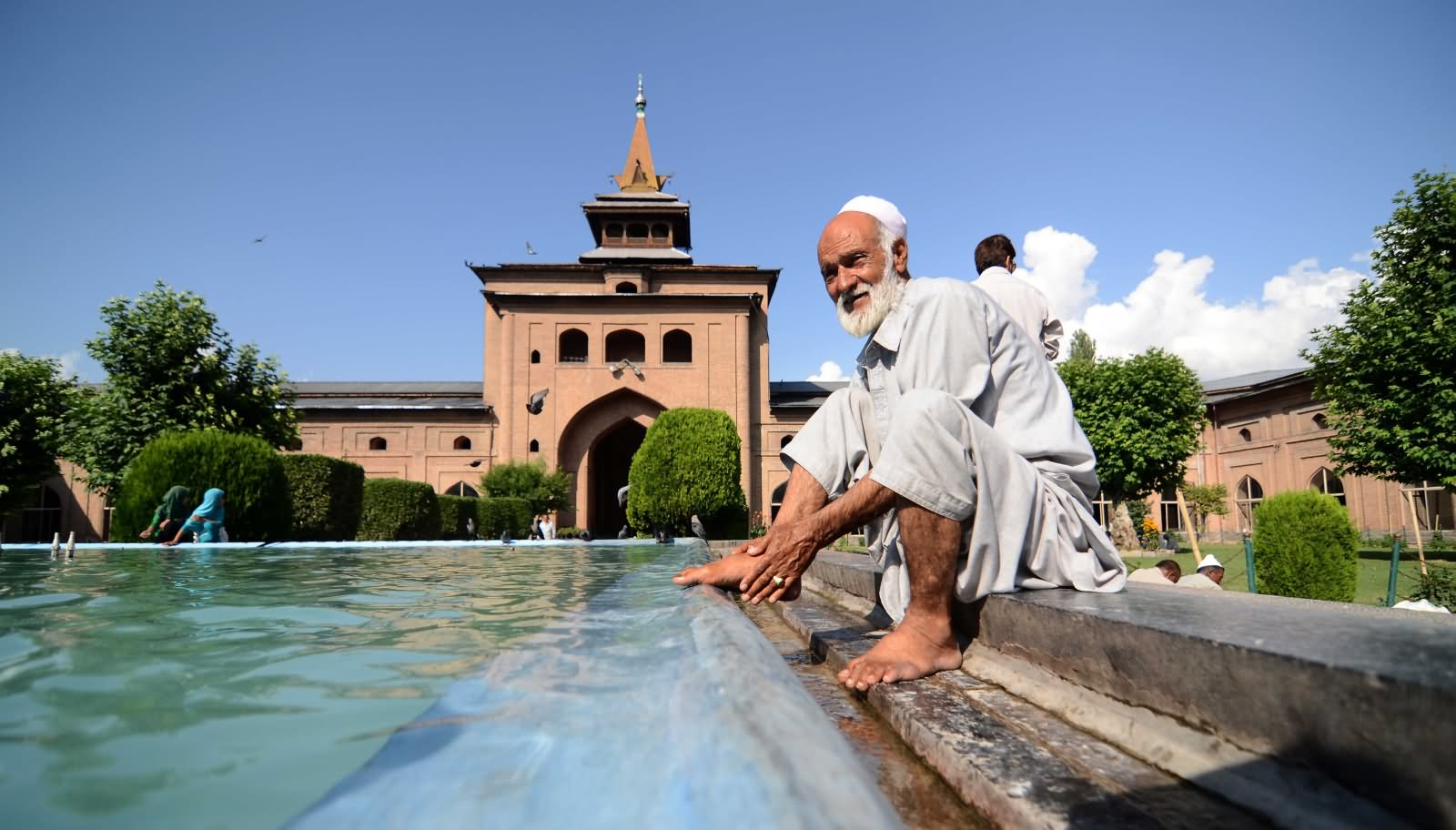 An Old Man Performing Ablution At The Jamia Masjid Srinagar