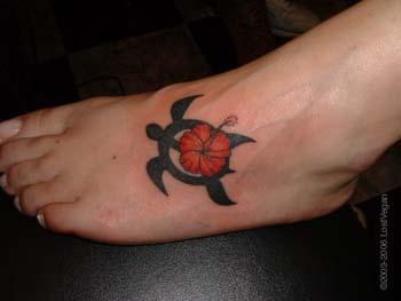 Black Tribal Turtle And Hibiscus Tattoo On Left Foot