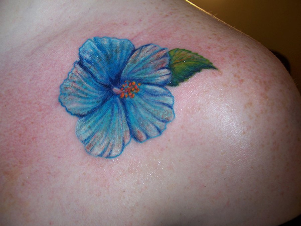 Blue Hibiscus Tattoo On Front Shoulder
