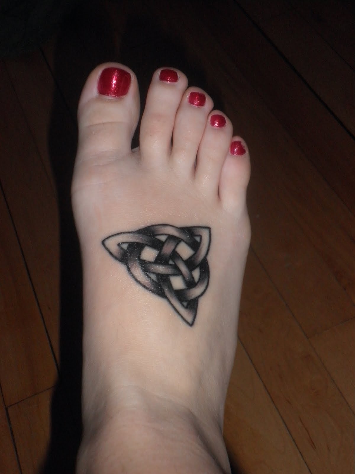 Celtic Knot Symbol Tattoo On Girl Foot