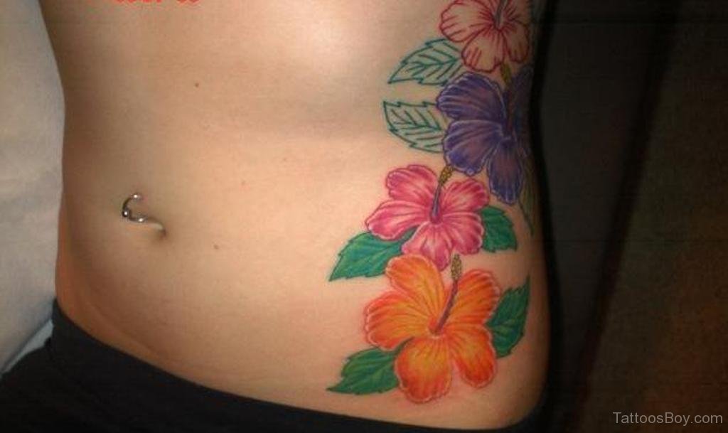 Colored Hibiscus Tattoo On Girl Side Rib