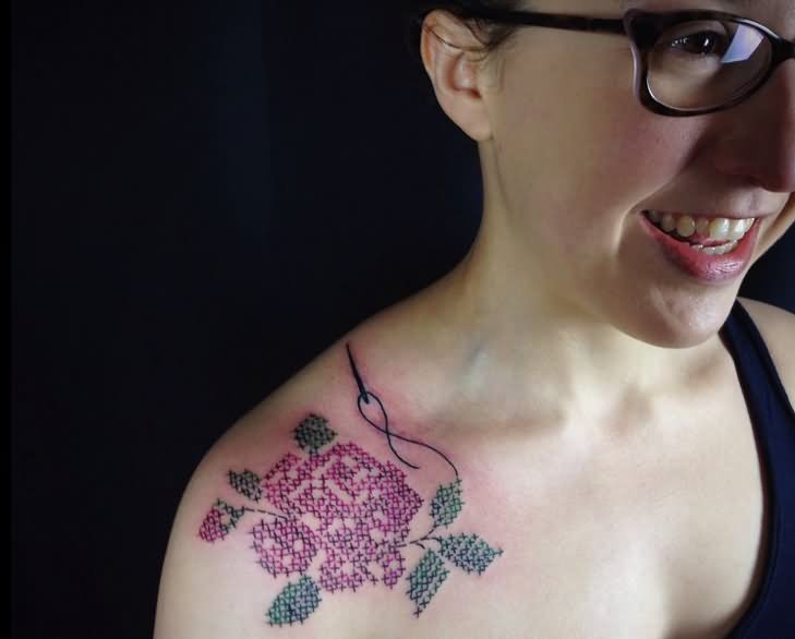Cross Stitch Flower Tattoo On Girl Right Front Shoulder