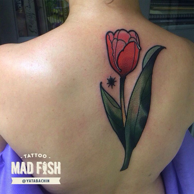 Cross Stitch Flower Tattoo On Upper Back