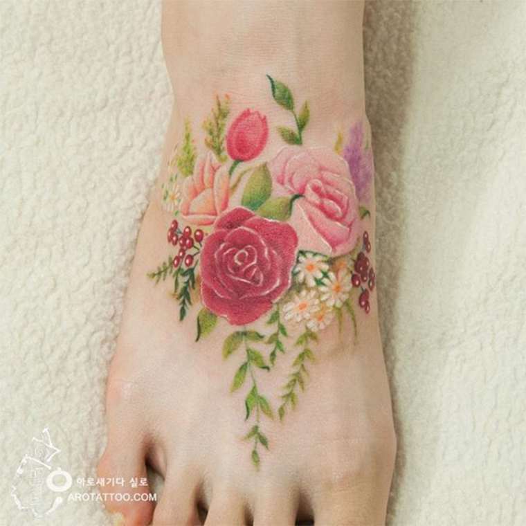 Cross Stitch Flowers Tattoo On Foot