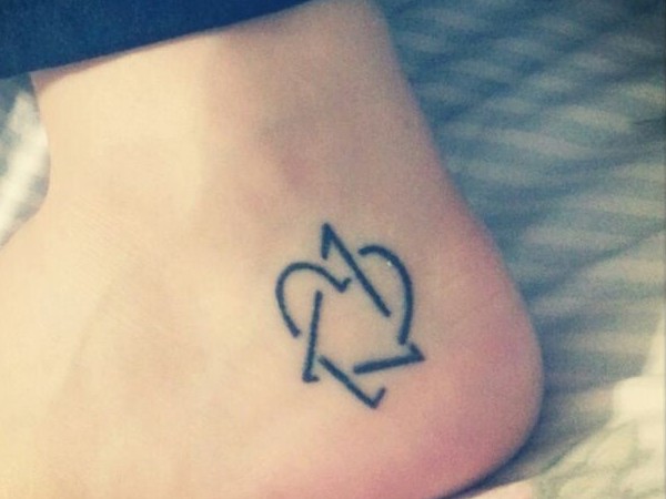 Love Symbol Tattoo On Heel