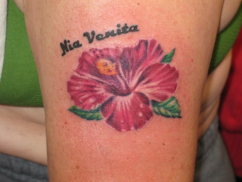 Nia Verita Hibiscus Flower Tattoo On Bicep