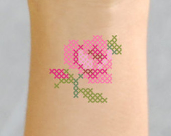 Pink And Green Cross Stitch Tattoo Design For Arm