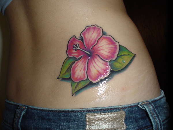 Pink Hibiscus Tattoo On Girl Lower Back