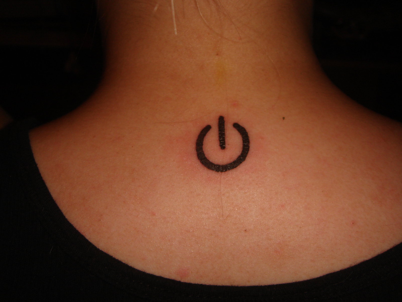 Power Symbol Tattoo On Upper Back