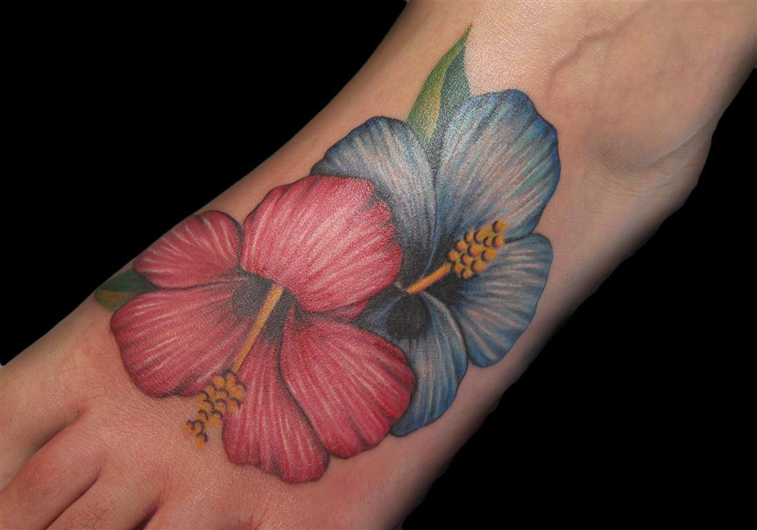 Red And Blue Hibiscus Tattoos On Left Foot