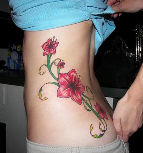 Red Hibiscus Flowers Tattoo On Left Rib Side