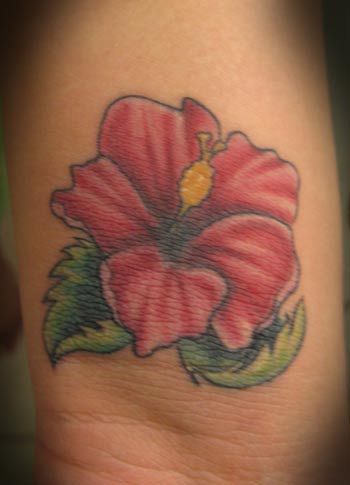 Small Red Hibiscus Tattoo On Wrist